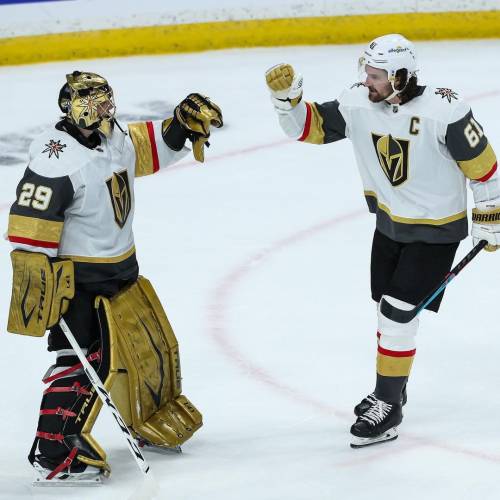 Mark Stone fist bumps Marc-Andre Fleury of the Vegas Golden Knights