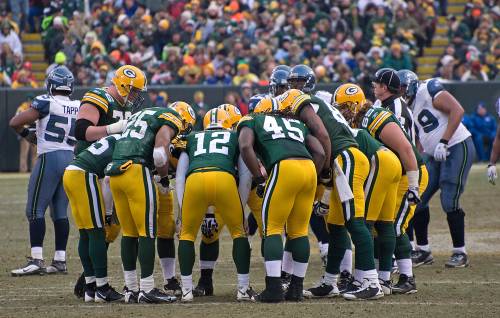 Green Bay Packers in a huddle
