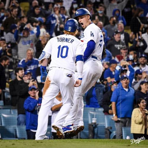 LA Dogers' Corey Seager celebrates with teammate Justin Turner