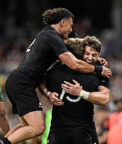 All Blacks' Beauden Barret celebrating with his teammates