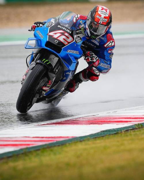 Suzuki's Álex Rins racing in the wet