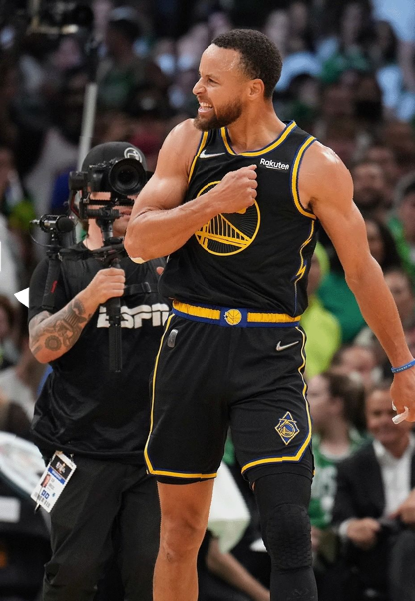 The Golden State Warrior's Steph Curry celebrates