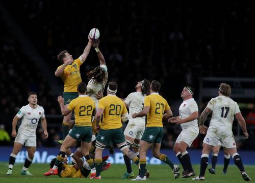 Rugby Match Between Australia and England Where Two Players are Fighting for the Ball in the Air
