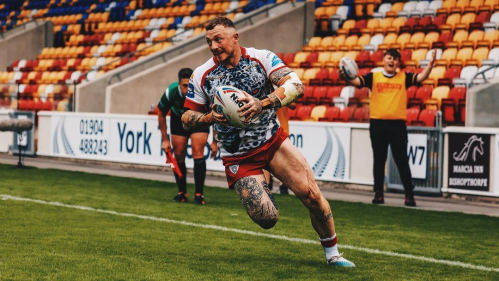 Josh Charnley running with the ball.