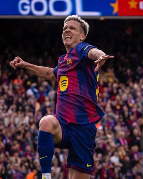 Dani Olmo celebrates after scoring for Barcelona